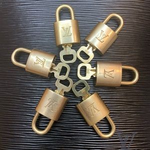 Authentic Louis Vuitton lock with key.